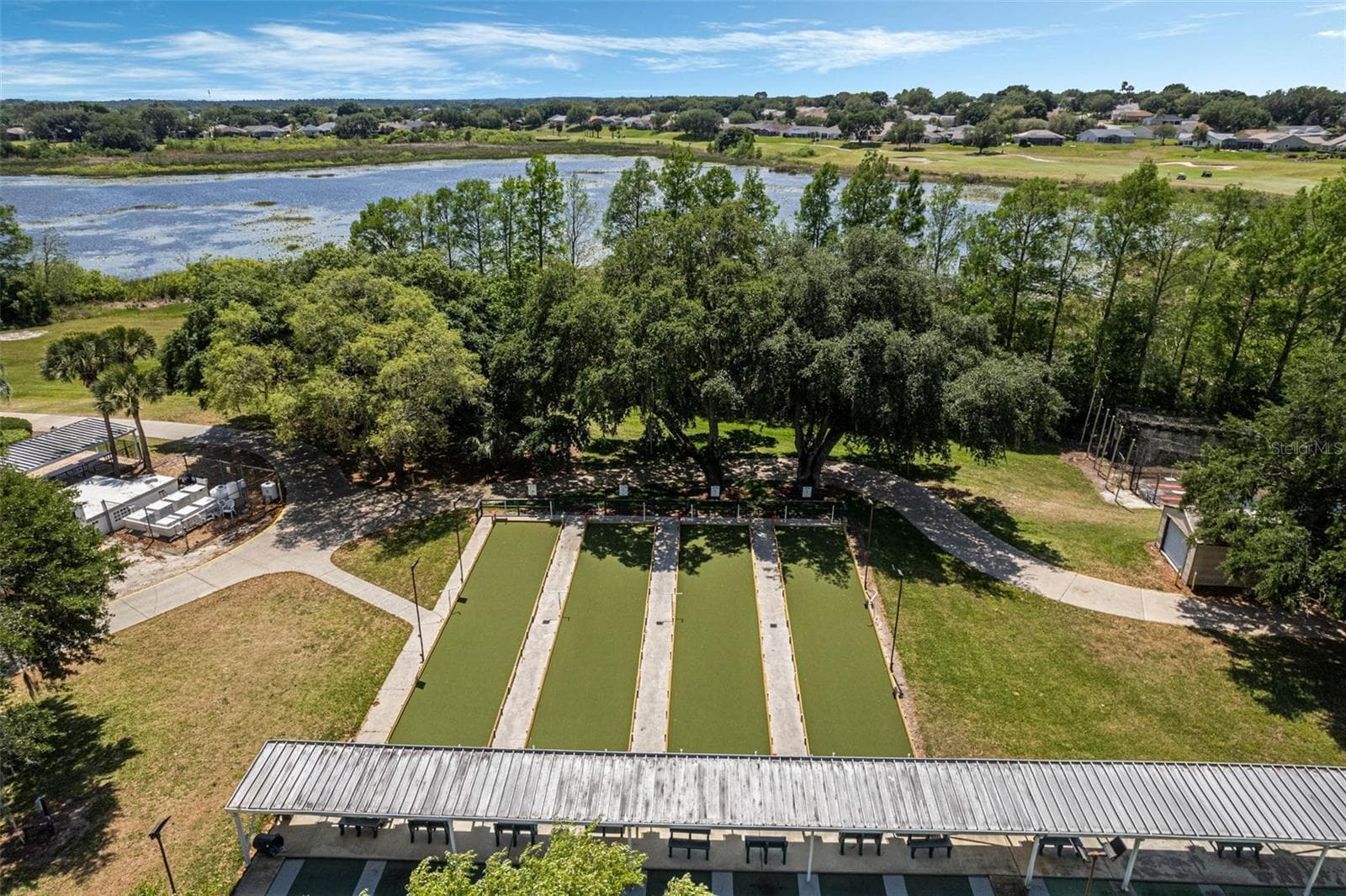 Community amenity: aerial view of the bocce courts and lake - 25038 CLIFFORD HL, LEESBURG
