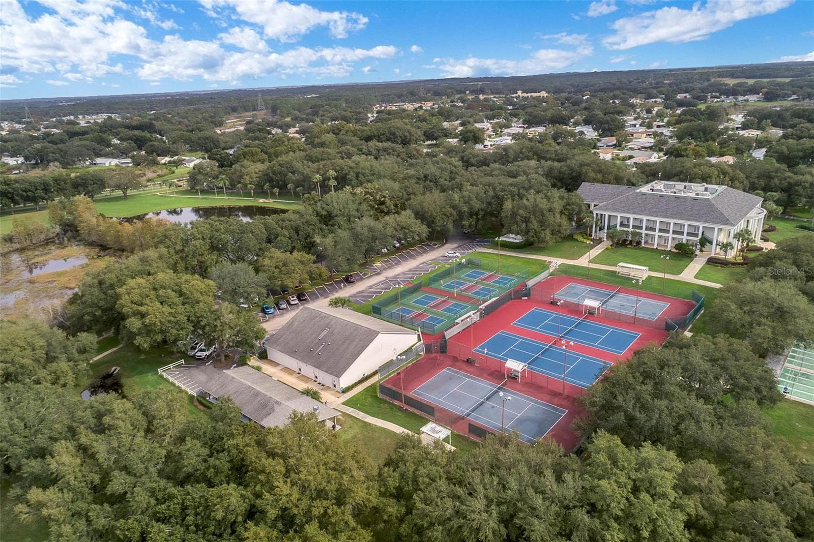 Community amenity: aerial view of the clubhouse and court complex - 25038 CLIFFORD HL, LEESBURG