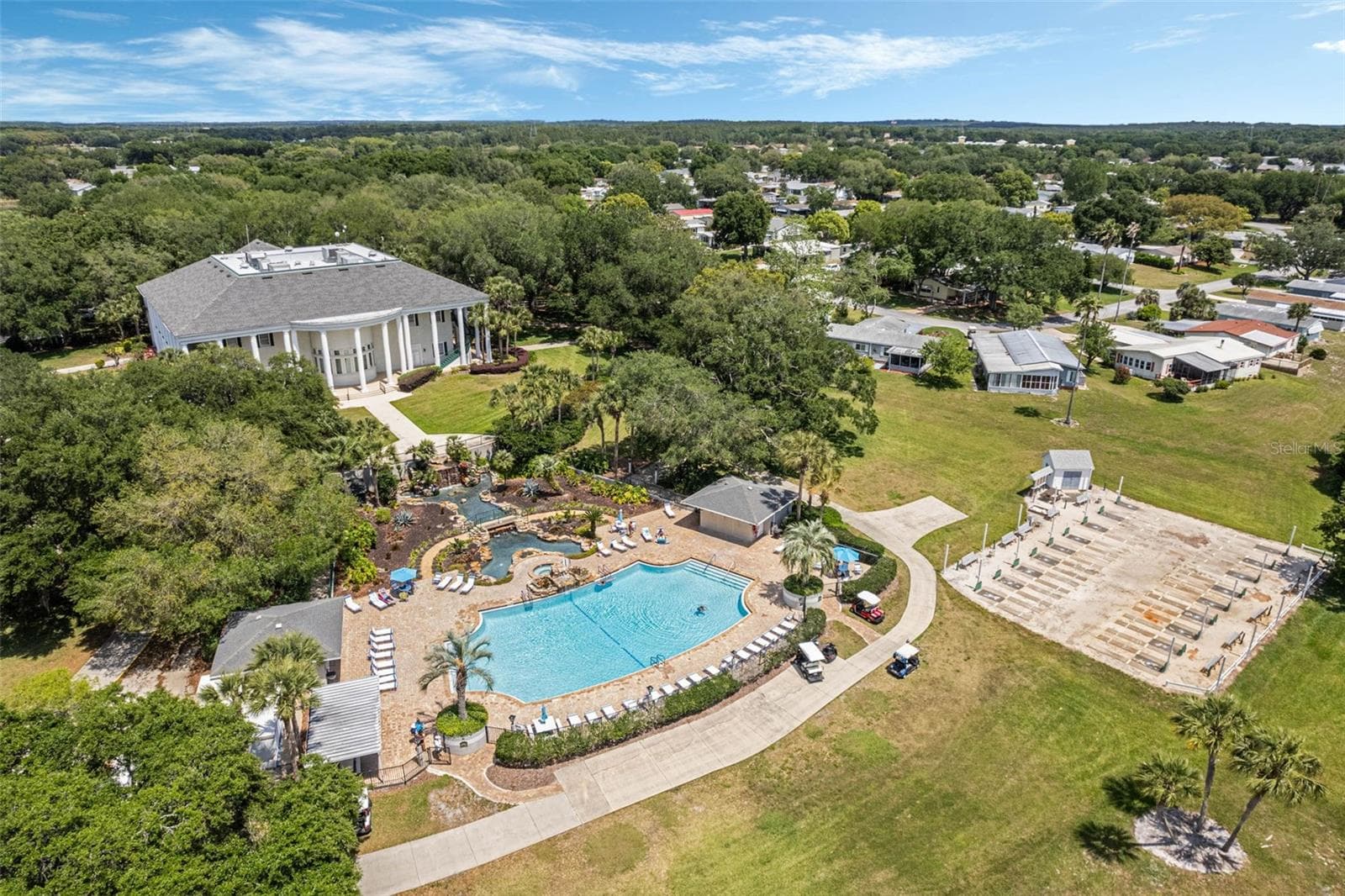 Community amenity: aerial view of the clubhouse and pool - 25038 CLIFFORD HL, LEESBURG