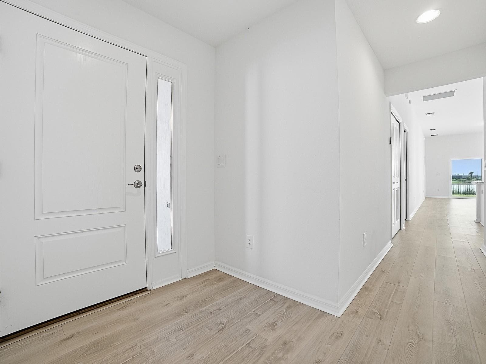 The entry hall looking toward the back of the house - 1359 DARREN DR, THE VILLAGES