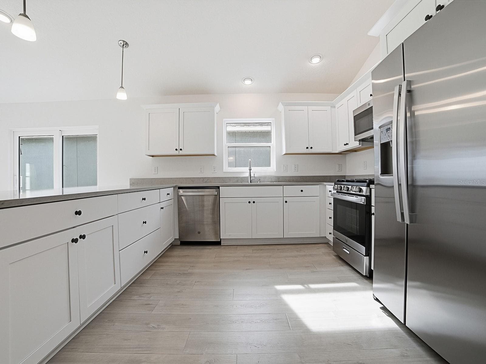 Kitchen view and the window over the sink is why this model is so popular - 1359 DARREN DR, THE VILLAGES