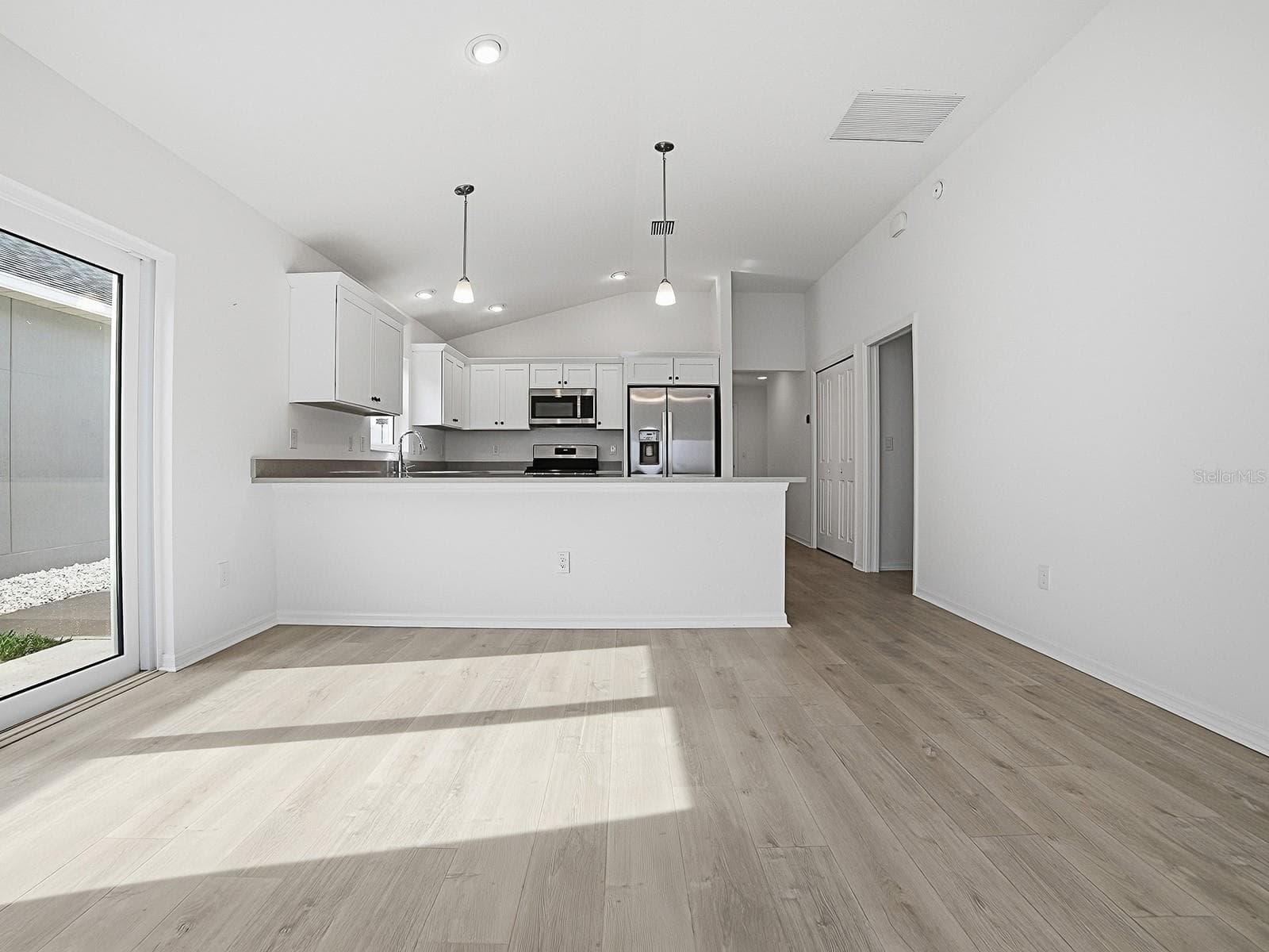 View of kitchen from living area - 1359 DARREN DR, THE VILLAGES