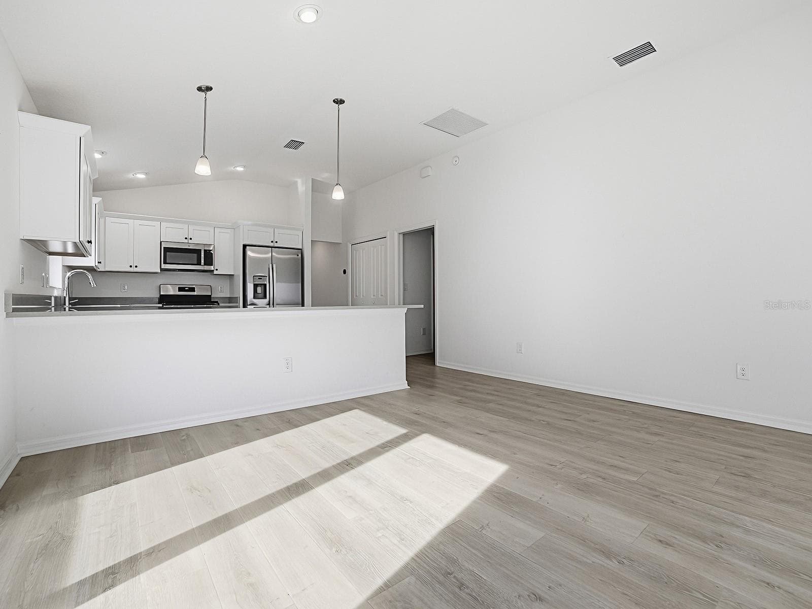 Another view of kitchen from living area - 1359 DARREN DR, THE VILLAGES