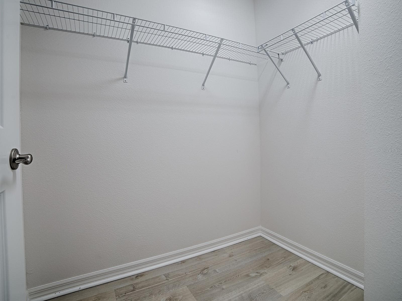 This is the second duplicate closet in the primary bedroom - 1359 DARREN DR, THE VILLAGES