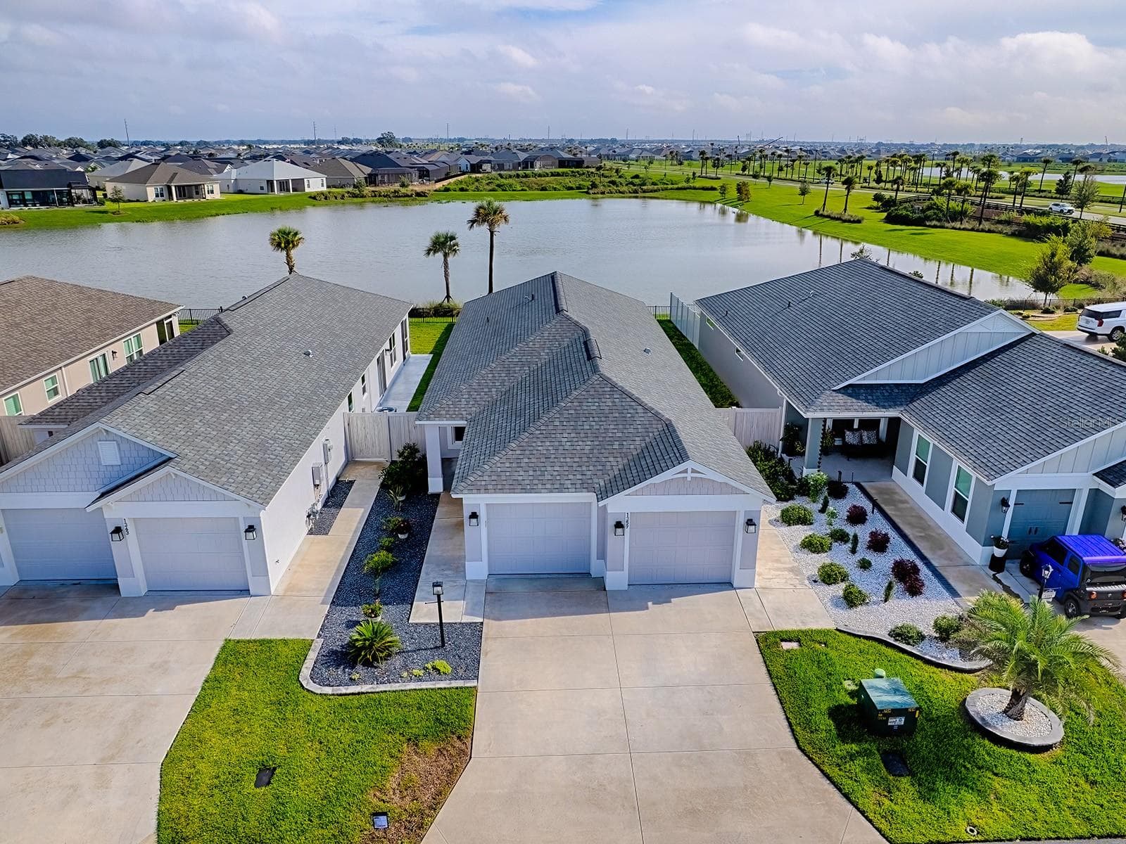Look at home from drone allowing view of the beautiful pond in the back of the home - 1359 DARREN DR, THE VILLAGES