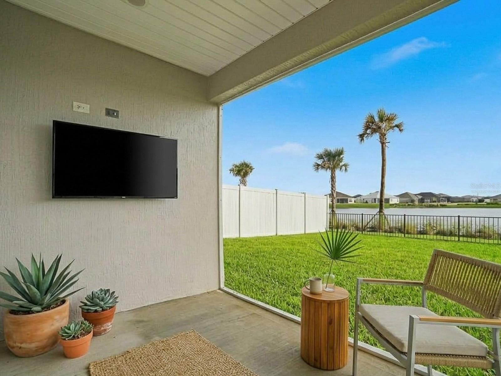 Virtually staged patio picture looking at pond - 1359 DARREN DR, THE VILLAGES