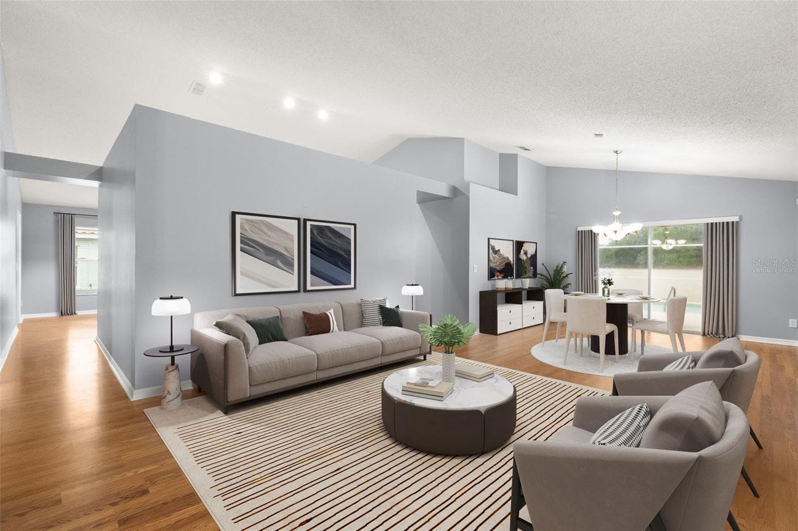 Virtually staged living and dining room and view from your front entry - 755 VIA MILANO, APOPKA