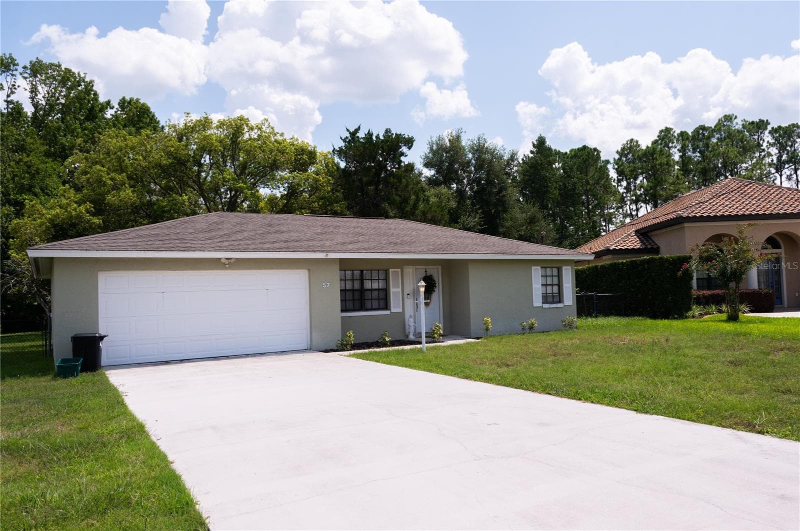 This property offers ample parking space, providing convenience for residents and guests alike. - 57 FORRESTER PL, PALM COAST