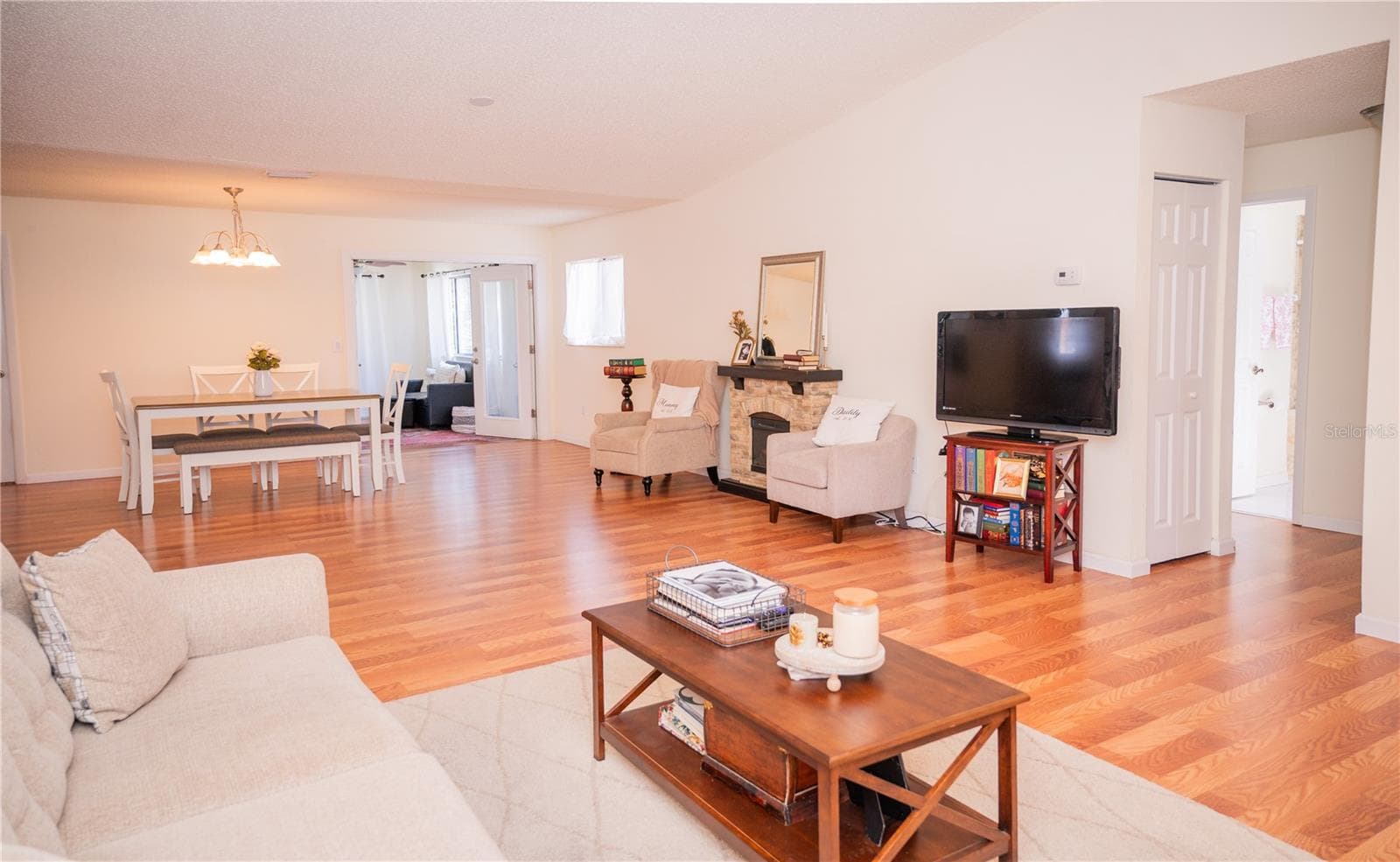 This bright, inviting view highlights the home's natural light, spacious office area, and beautiful plank vinyl flooring. - 57 FORRESTER PL, PALM COAST