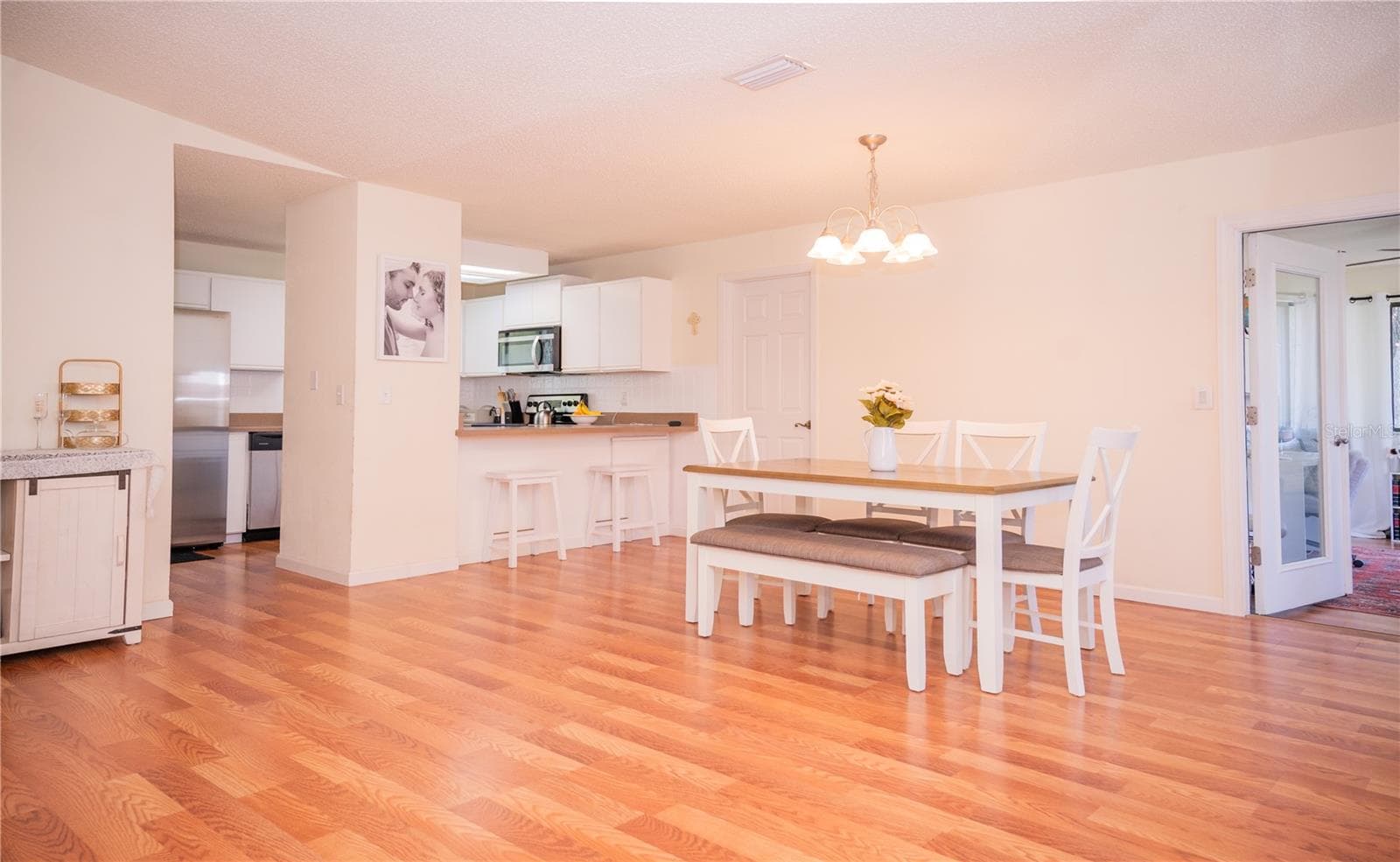 View from the great room looking toward the kitchen. - 57 FORRESTER PL, PALM COAST