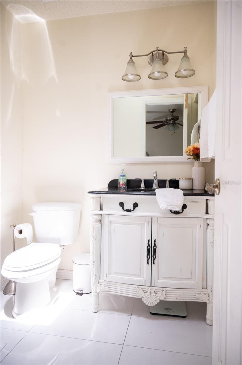 Ensuite primary bathroom with custom cabinetry and premium finishes. - 57 FORRESTER PL, PALM COAST