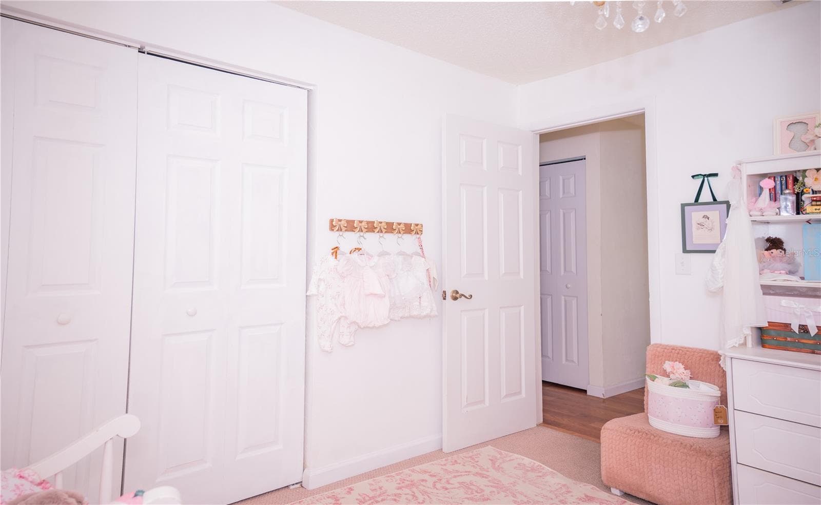 This room offers a peaceful view looking out into the hallway, highlighting the desirable split-bedroom floor plan. - 57 FORRESTER PL, PALM COAST