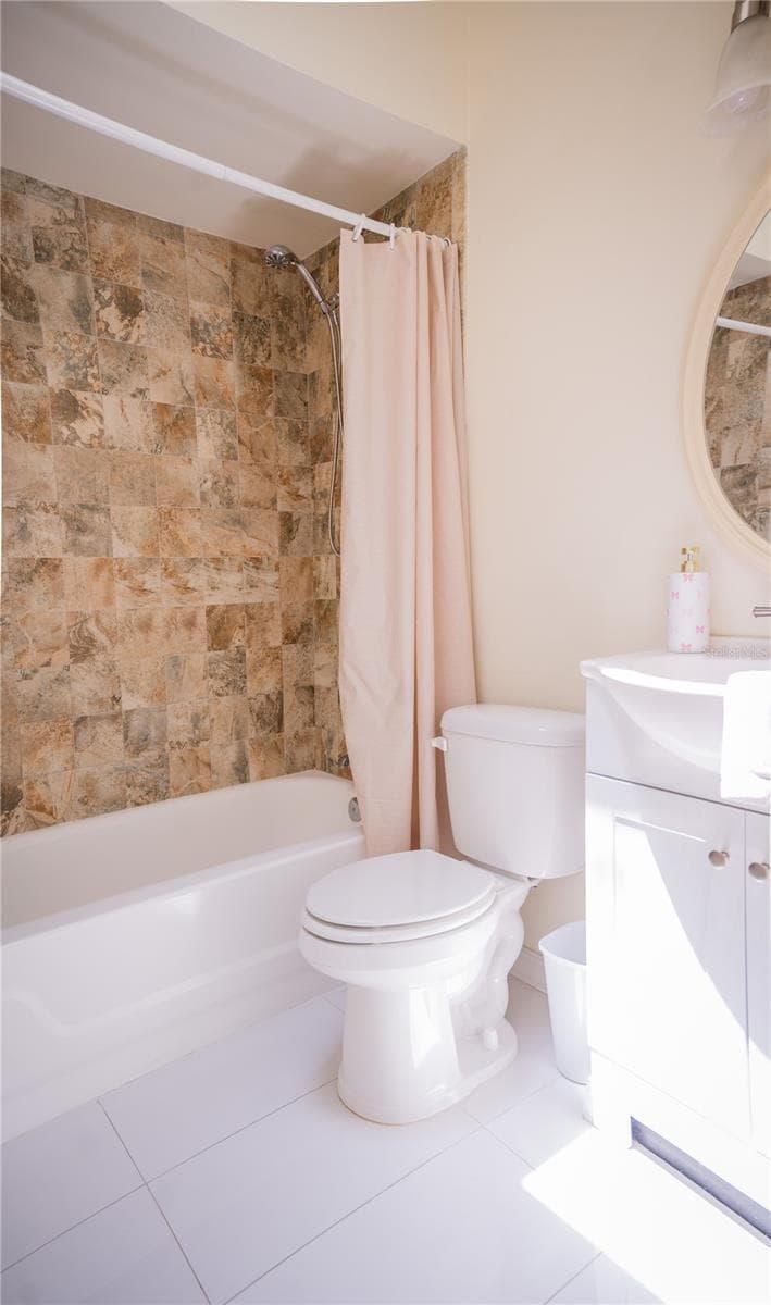 Second bathroom featuring a modern vanity, updated fixtures, and a fully tiled shower. - 57 FORRESTER PL, PALM COAST