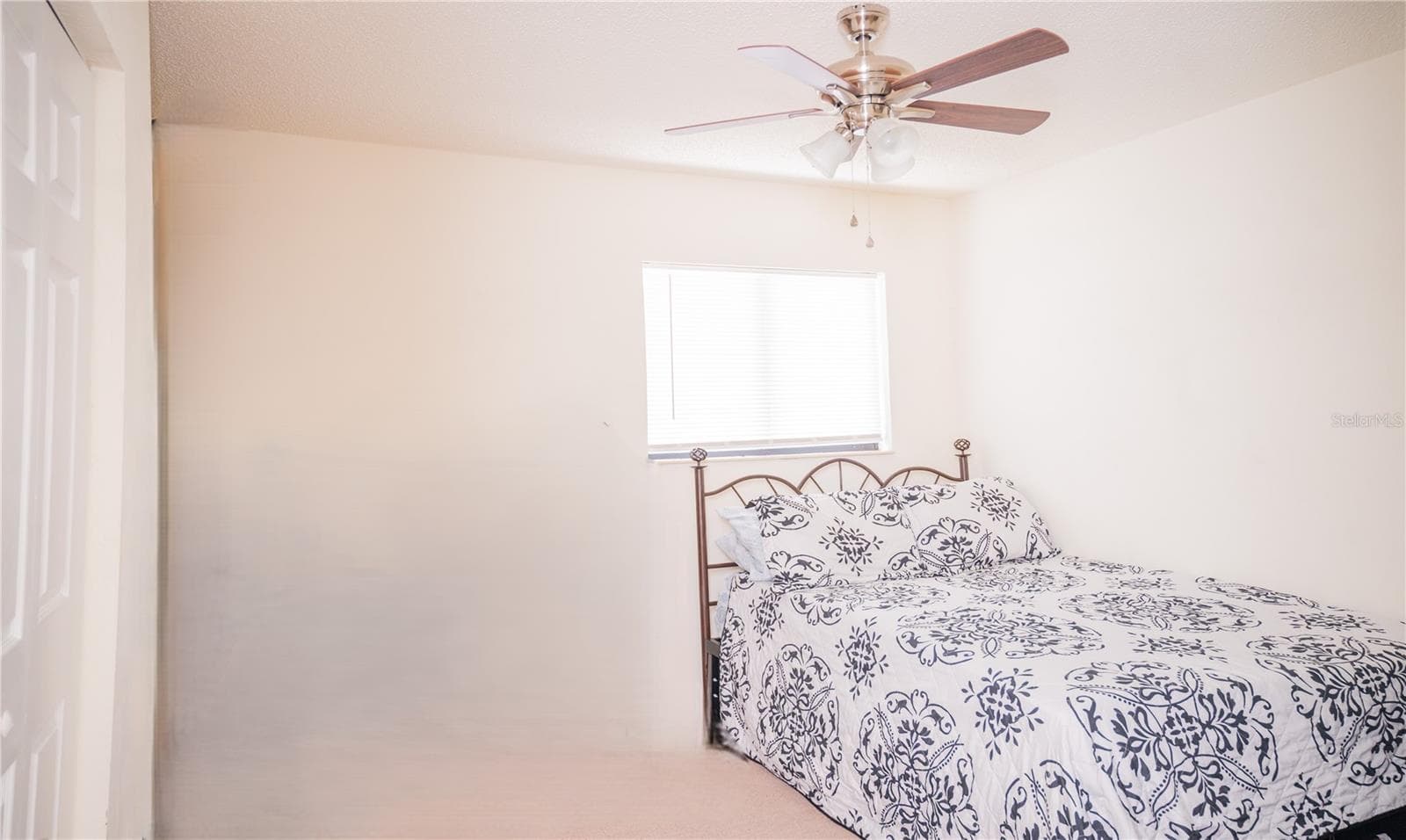 Third bedroom, currently staged as a guest suite. - 57 FORRESTER PL, PALM COAST