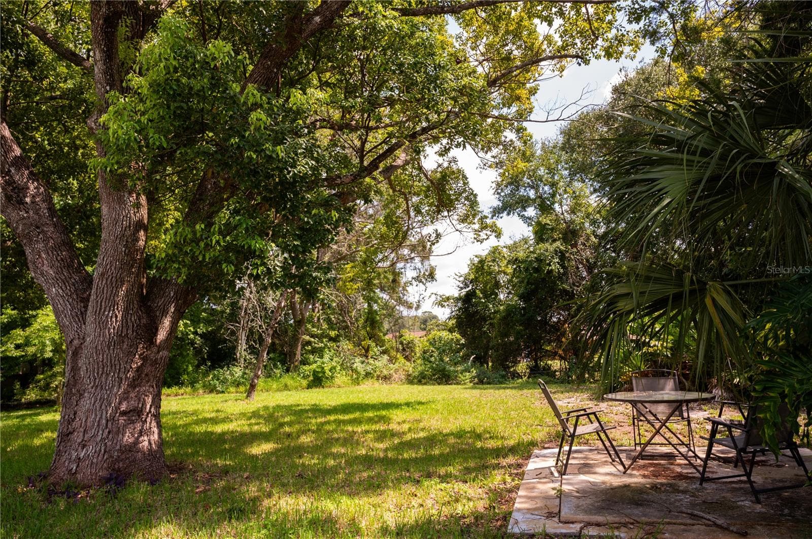 Beautifully situated on a lot surrounded by mature, established shade trees. - 57 FORRESTER PL, PALM COAST