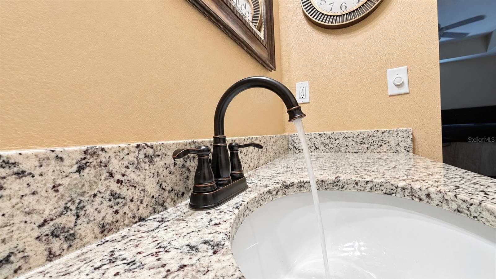 Bright Bronze Faucet with Granite Vanity - 26397 NADIR RD #103, PUNTA GORDA