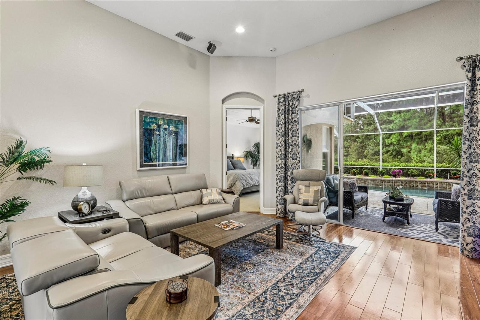 LR toward back pool area & lanai - 27443 MISTFLOWER DR, WESLEY CHAPEL