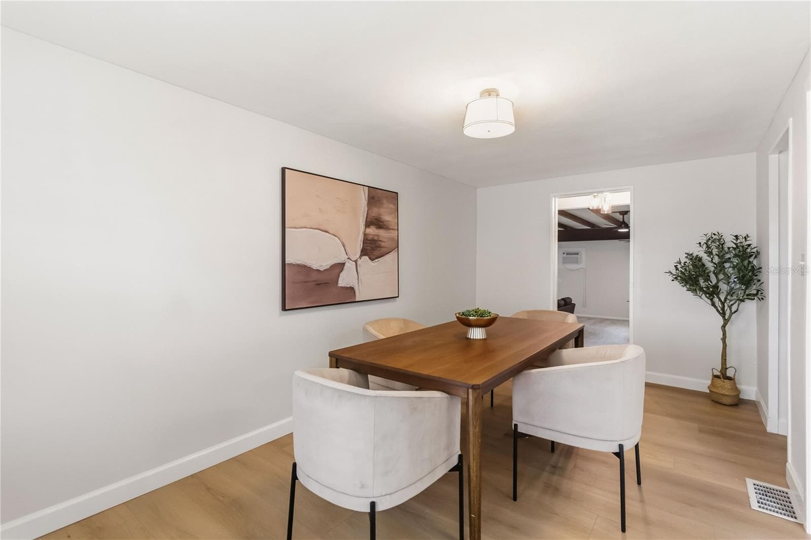Dining room with steps down into the family/game room/Multi-Purpose - 7040 LAKE DR, ORLANDO