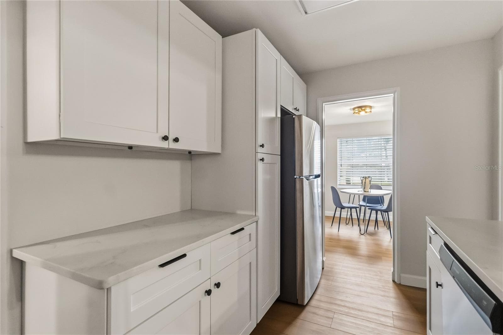 This kitchen is well thought out for significant storage and even a pantry - 7040 LAKE DR, ORLANDO