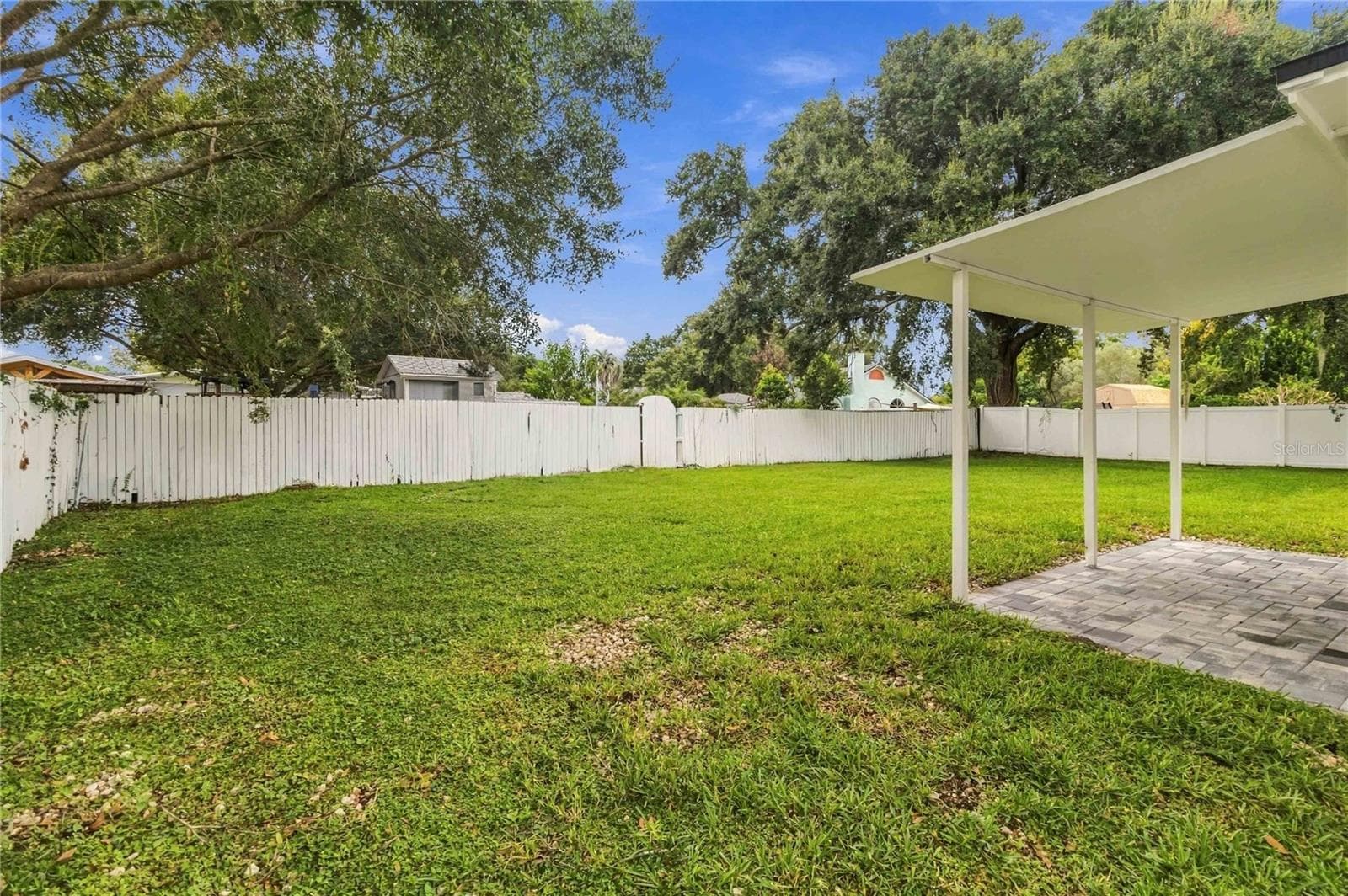 Covered patio with new Pavers, outside the family/game room/Multi Purpose thru the new sliding glass doors - 7040 LAKE DR, ORLANDO