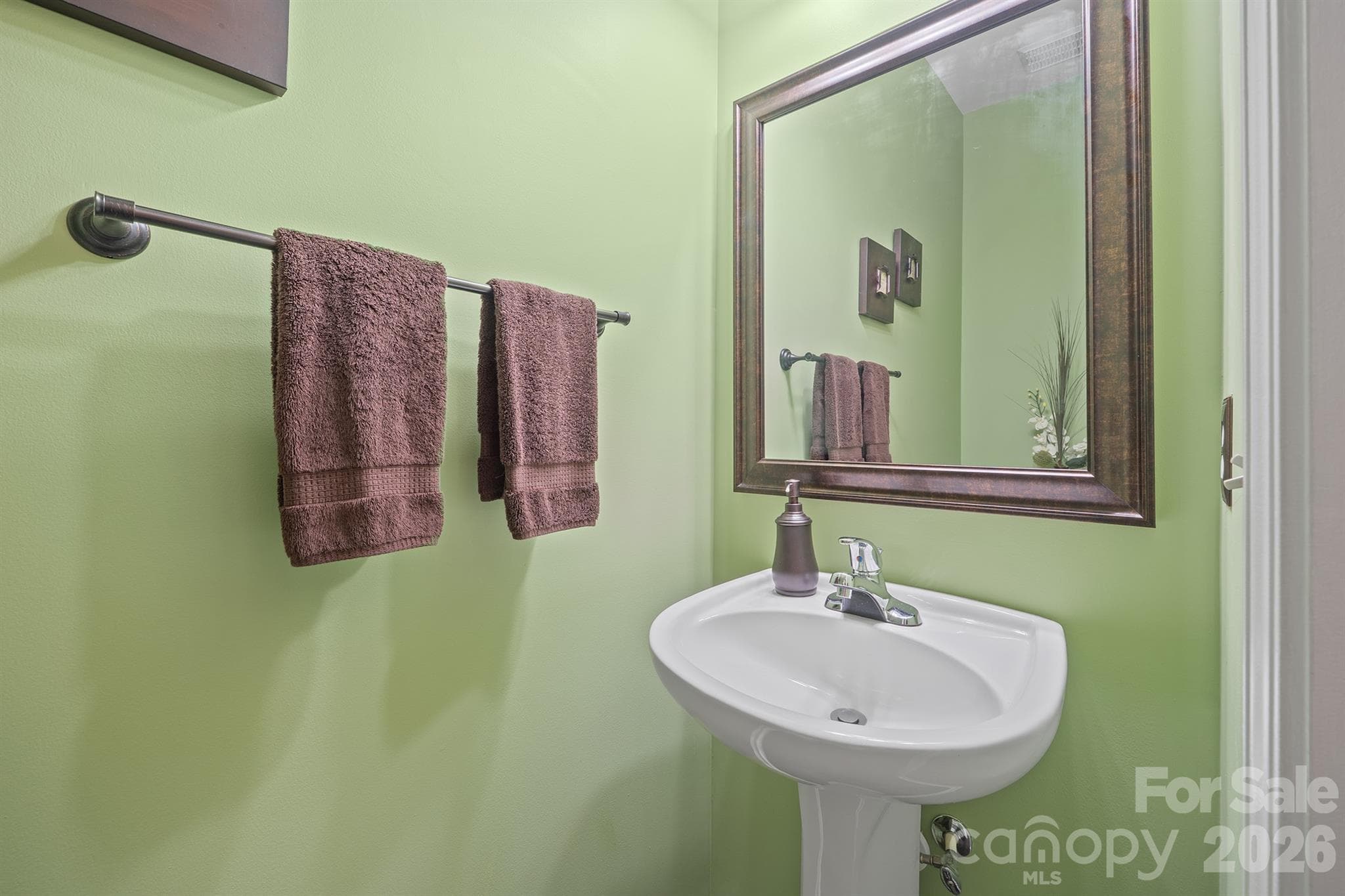 Powder room for guests conveniently located on the main level of the home. - 4144 Kenton Glenn Court NW, Concord