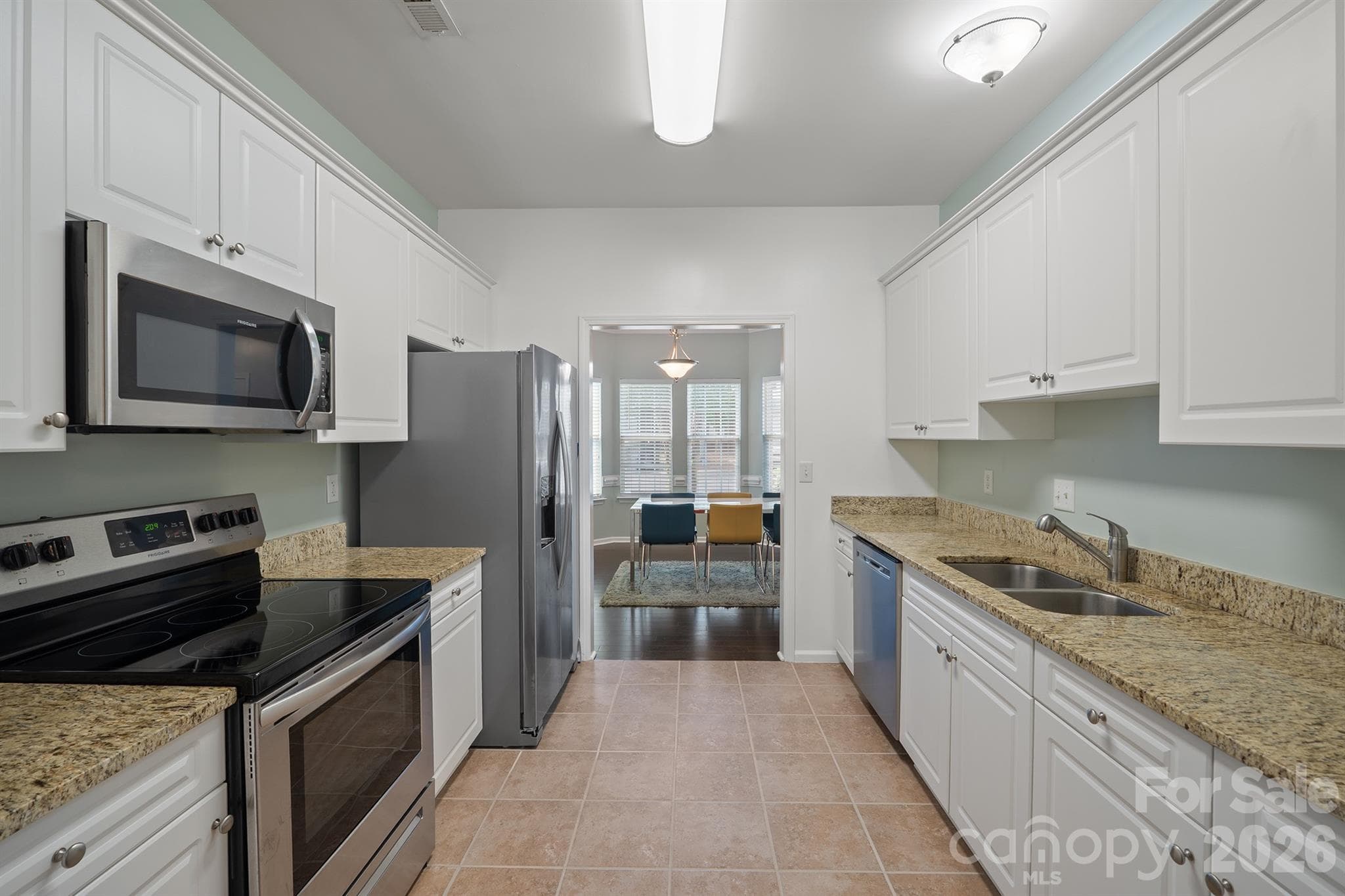 Granite countertops, stainless-steel appliances, lots of cabinets and tile flooring. - 4144 Kenton Glenn Court NW, Concord