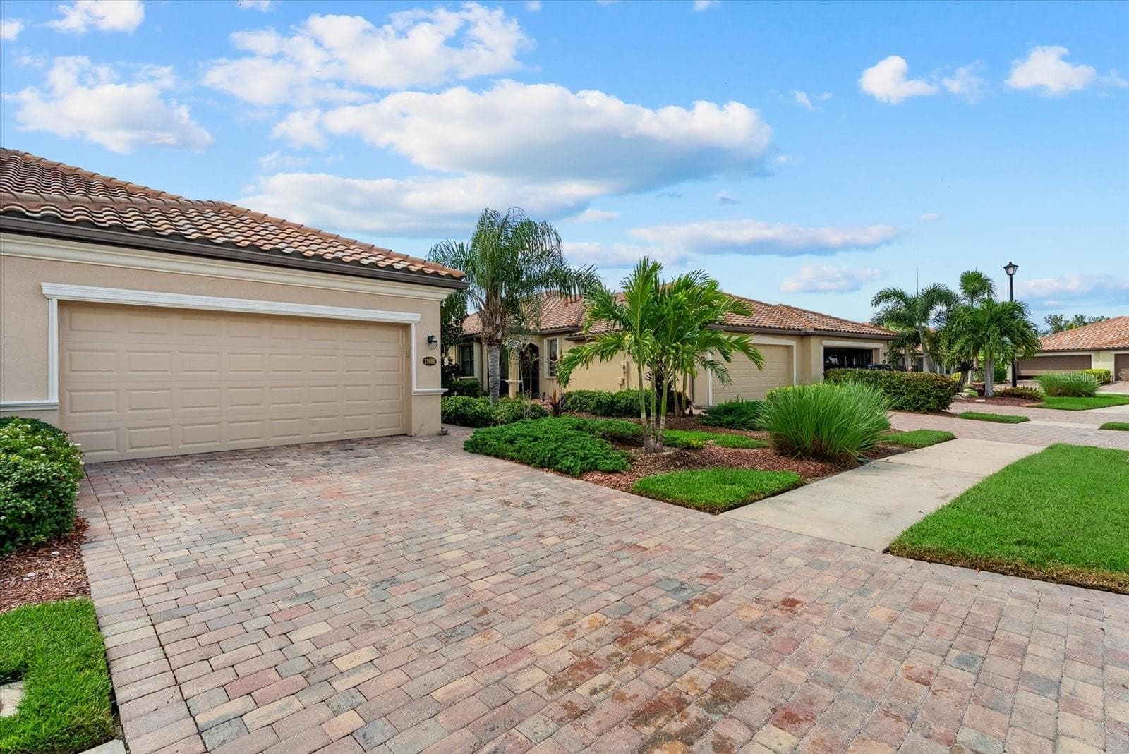 Front exterior and paver driveway - 19866 BENISSIMO DR, VENICE