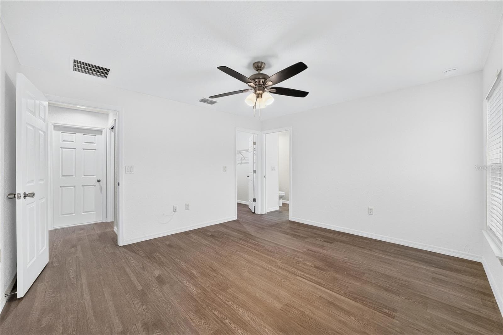 PRIMARY BEDROOM WITH LVP AND CELING FAN - 3 FISHER WAY PL, OCKLAWAHA