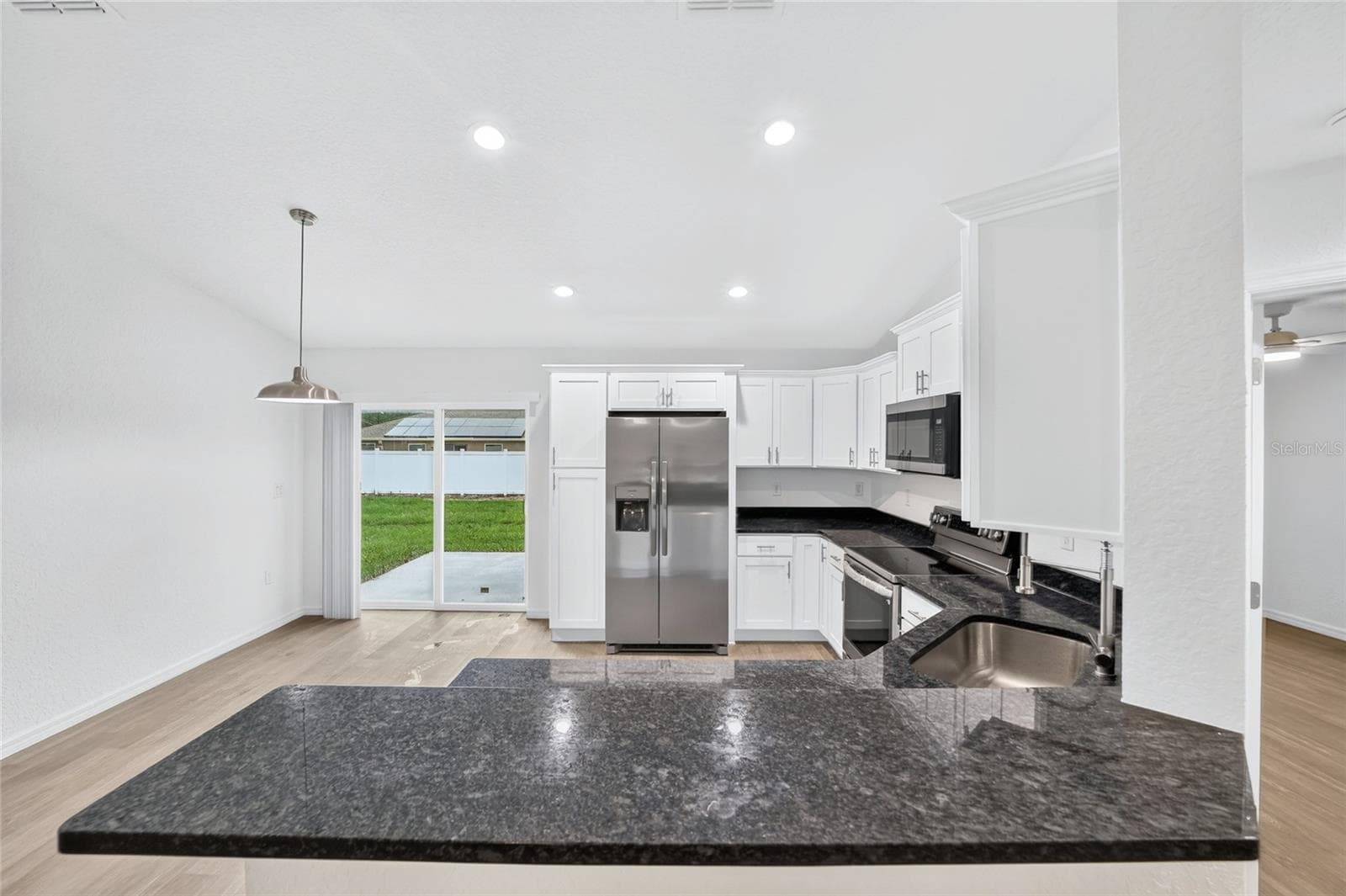 KITCHEN TO LIVING AREA - 3 FISHER WAY PL, OCKLAWAHA