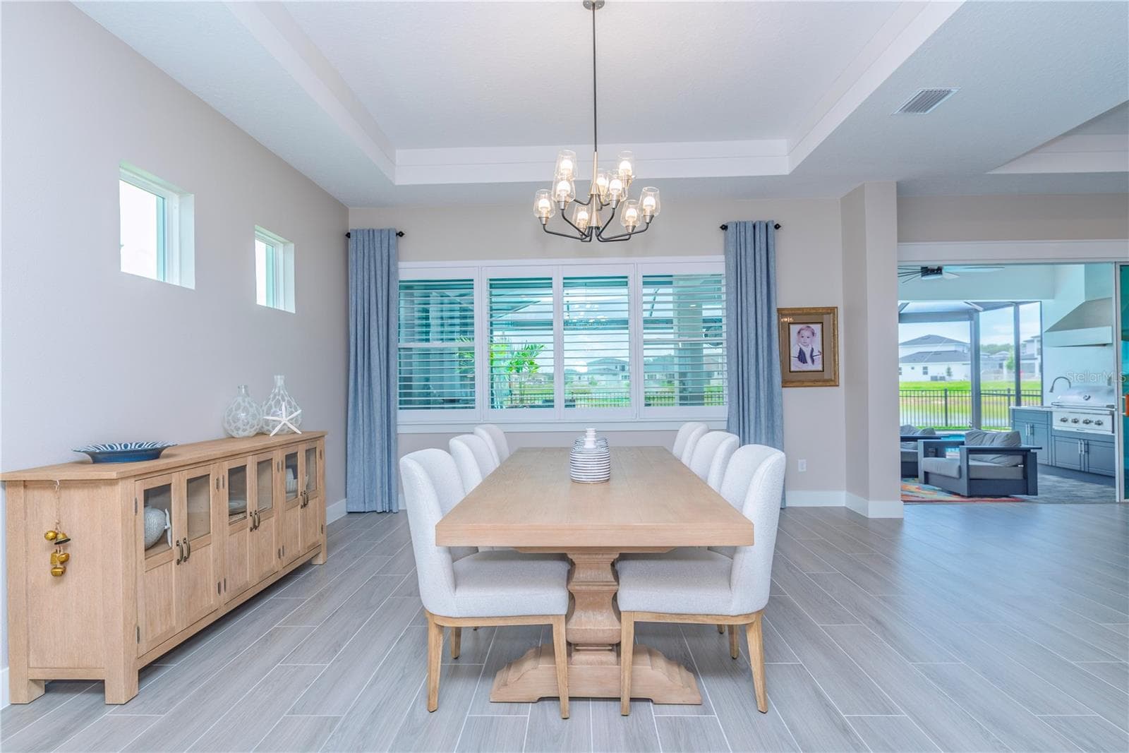 Dining room with view to lanai and water. - 10706 TORCHWOOD SEA WAY, SAN ANTONIO