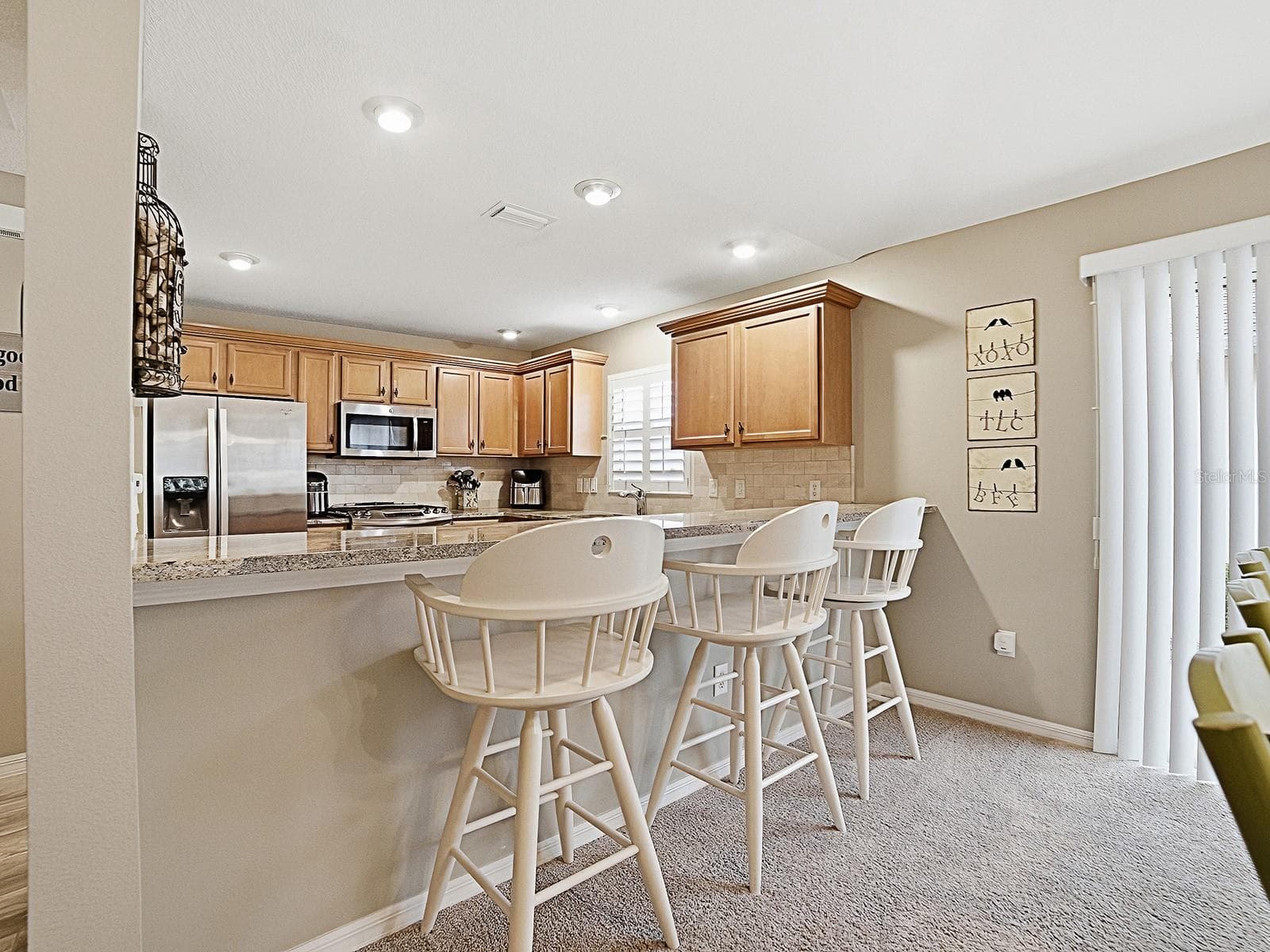 Enjoy the breakfast bar with sliding doors to patio - 1530 BARNWELL PL, THE VILLAGES