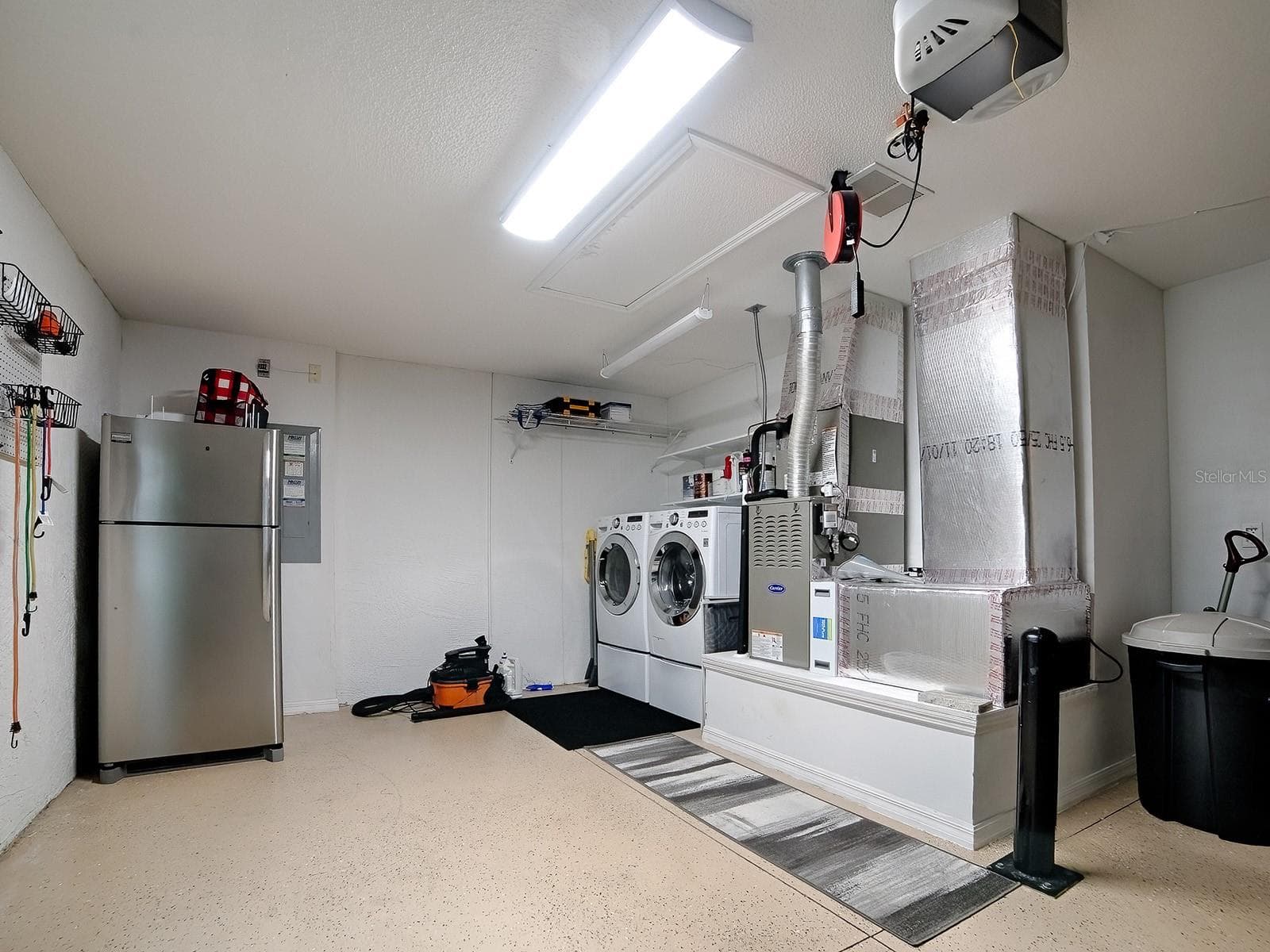 Clean and efficient Laundry space with extra refrigerator when those guests show up - 1530 BARNWELL PL, THE VILLAGES