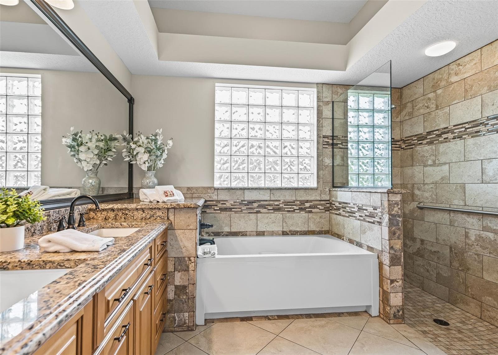 Primary Bathroom with tub and roman shower - 1802 ESTAFANA WAY, THE VILLAGES