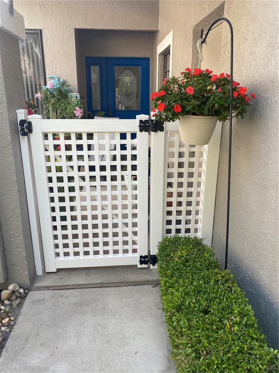 Front Entrance with new lattice & Gate - 5535 HAMPSTEAD HEATH #45, SARASOTA