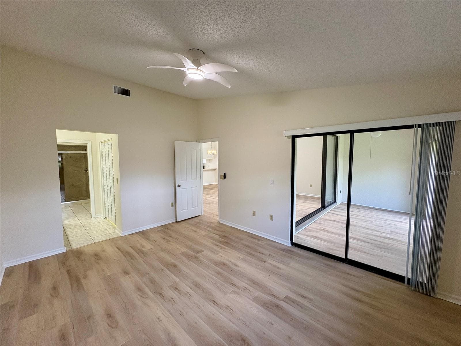 Primary Bedroom slider vacant - 5535 HAMPSTEAD HEATH #45, SARASOTA