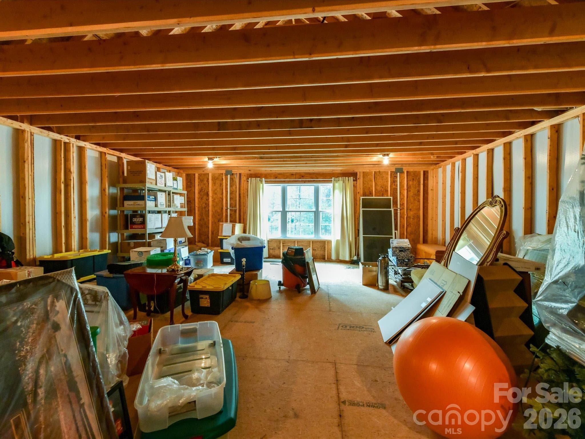 4 walk out storage spaces- one area is intended for finished space and is 632 sq ft. - 5923 Rocky River Road N, Indian Trail