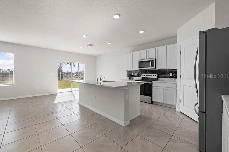 Kitchen coming from front door - 17249 WHEATBERRY BLVD, PARRISH