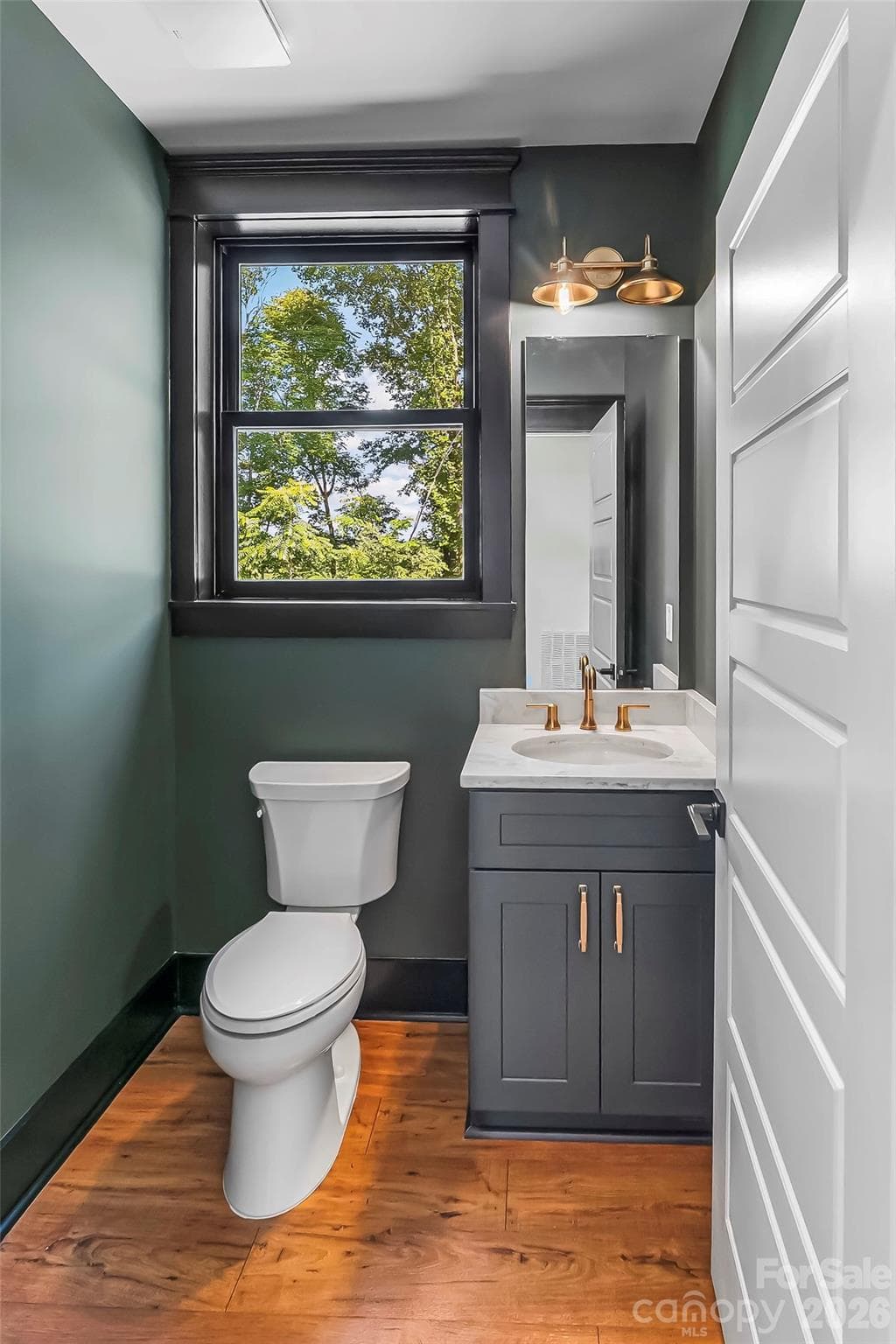 Main level powder room. - 4898 Soaring Top Lane, Lenoir