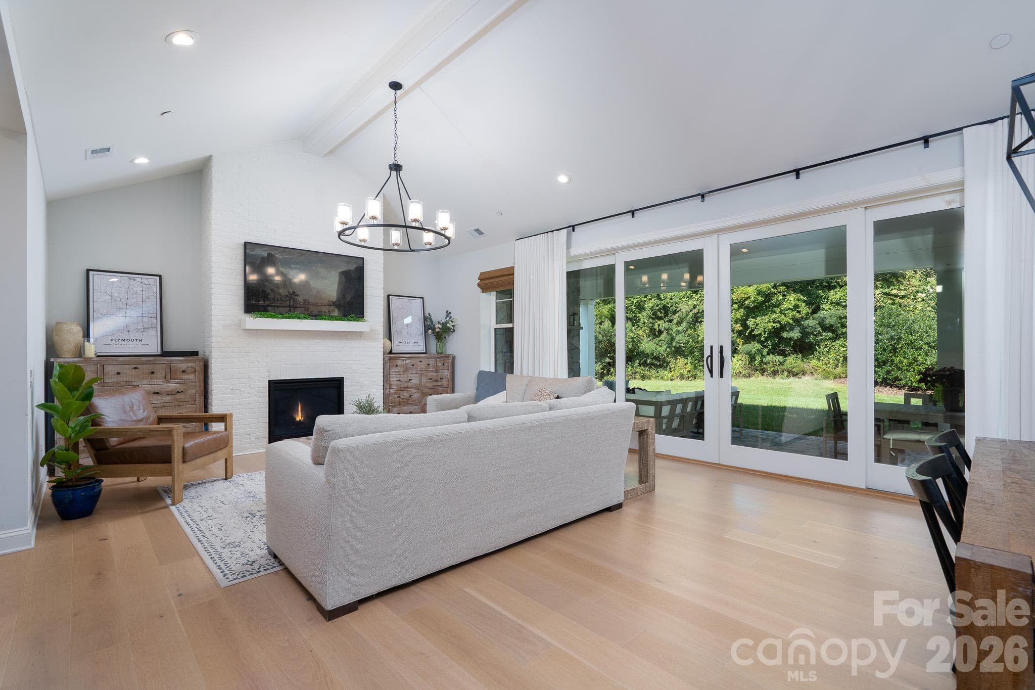 Vaulted Living Room Ceilings w/Brick Fireplace.  Large 4 panel sliding Patio Door - 9588 Pacing Lane NW, Concord