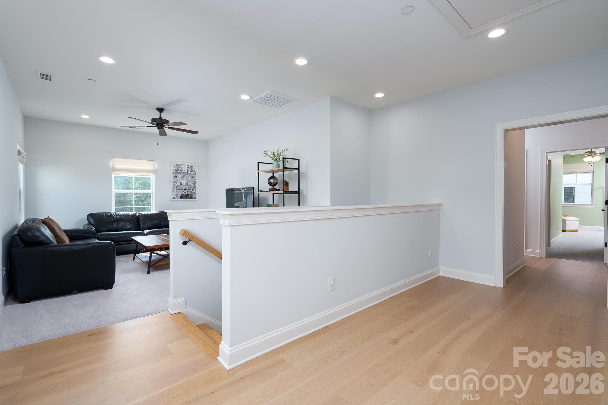 Blonde Hardwoods through the upstairs Hallway - 9588 Pacing Lane NW, Concord