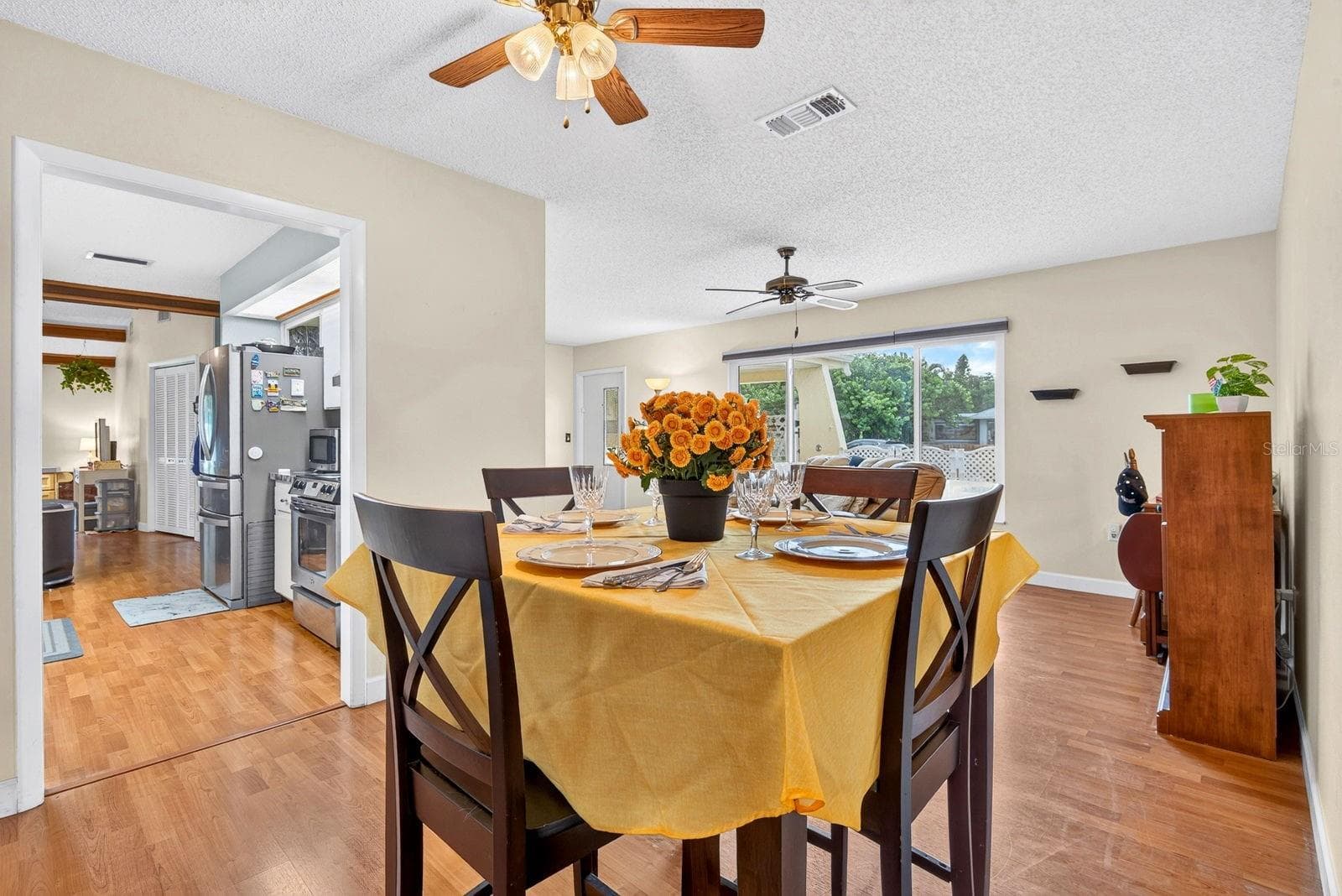 Dining area showing kitchen to the left and living room front window - 6806 21ST AVENUE TER W, BRADENTON