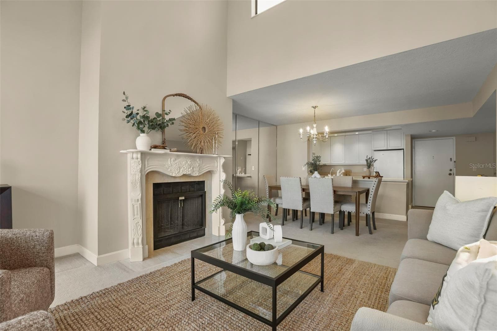 The living room is anchored by a gorgeously framed fireplace, a hard-to-find amenity in a condo home! - 300 CAROLINA AVE #402C, WINTER PARK