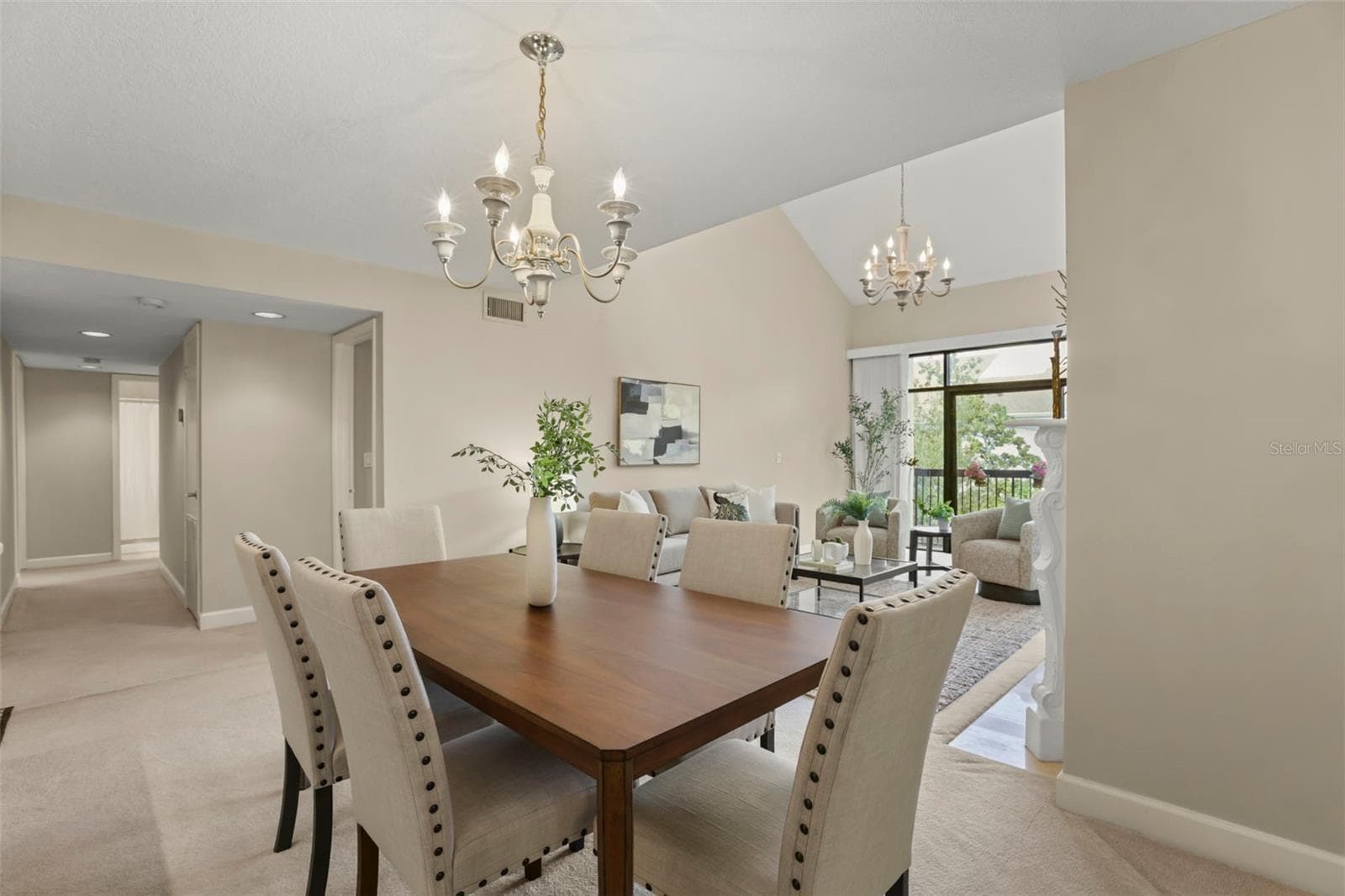 Perfect for both quiet dinners at home or large parties, the dining room seamlessly leads to the living room. - 300 CAROLINA AVE #402C, WINTER PARK