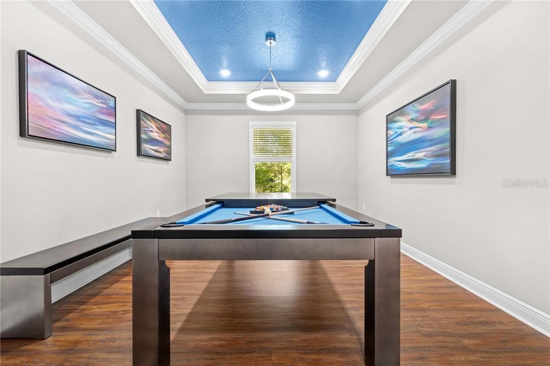 Flex Room is currently used as a Game Room with a Pool table that converts in a dining table with bench seating - 16 Elder CT E, HOMOSASSA FL 34446, Homosassa