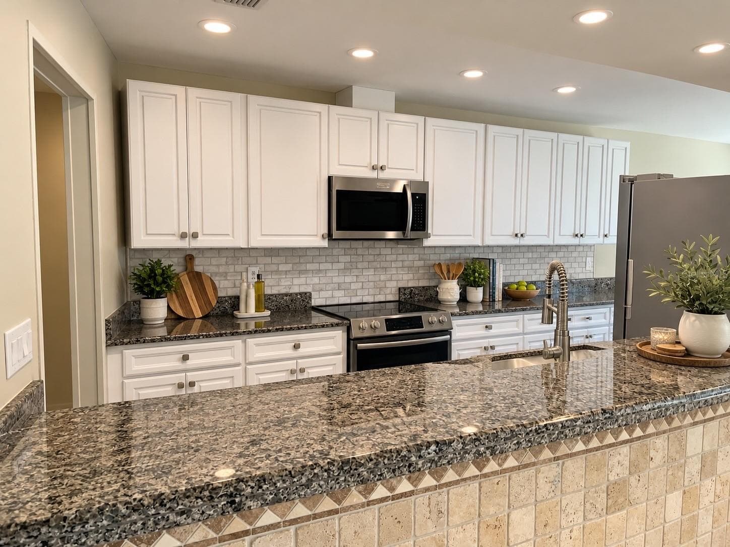 VIRTUAL Staged Kitchen view - 6993 COUNTRY LAKES CIR, SARASOTA