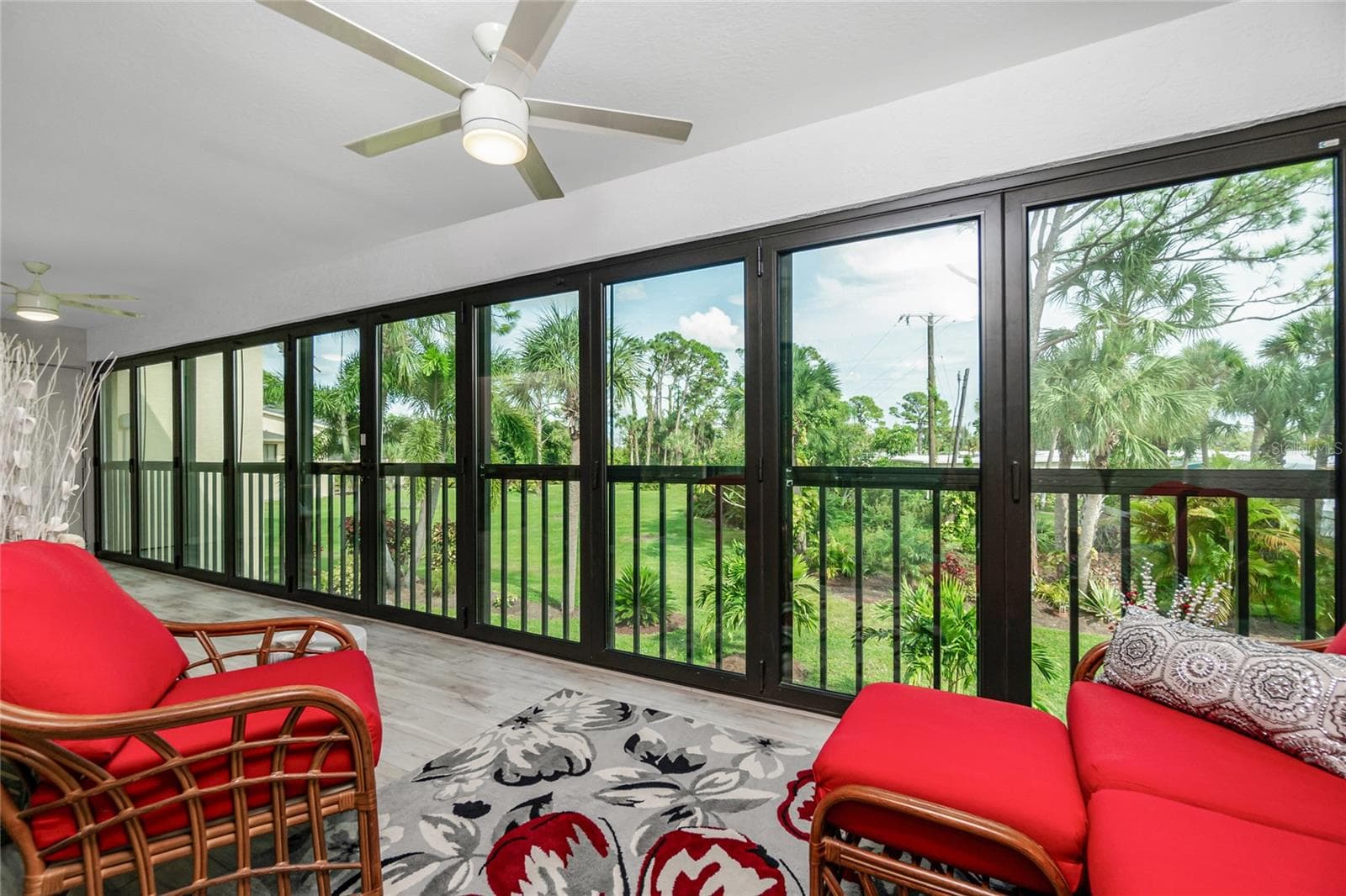 Florida room  Bifolding Impact sliding glass doors - 4260 PLACIDA RD #9D, ENGLEWOOD