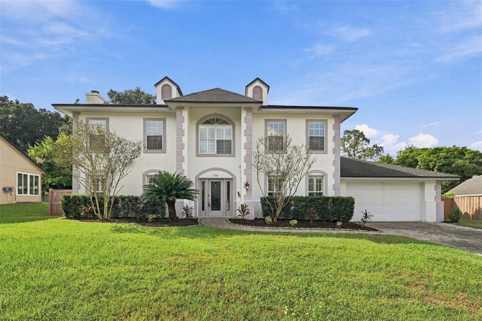 Welcome Home! Expanded Paver Driveway leading to 2+ car garage - 1349 VALLEY PINE CIR, APOPKA