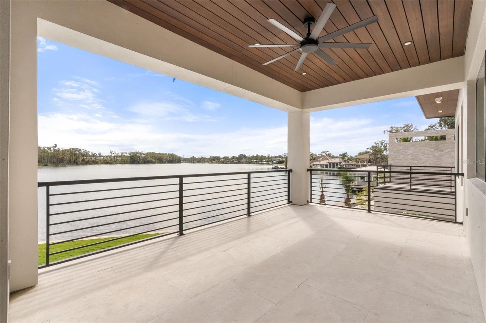 Balcony off the Entertaining Room with lake views - 9117 BAY POINT DR, ORLANDO
