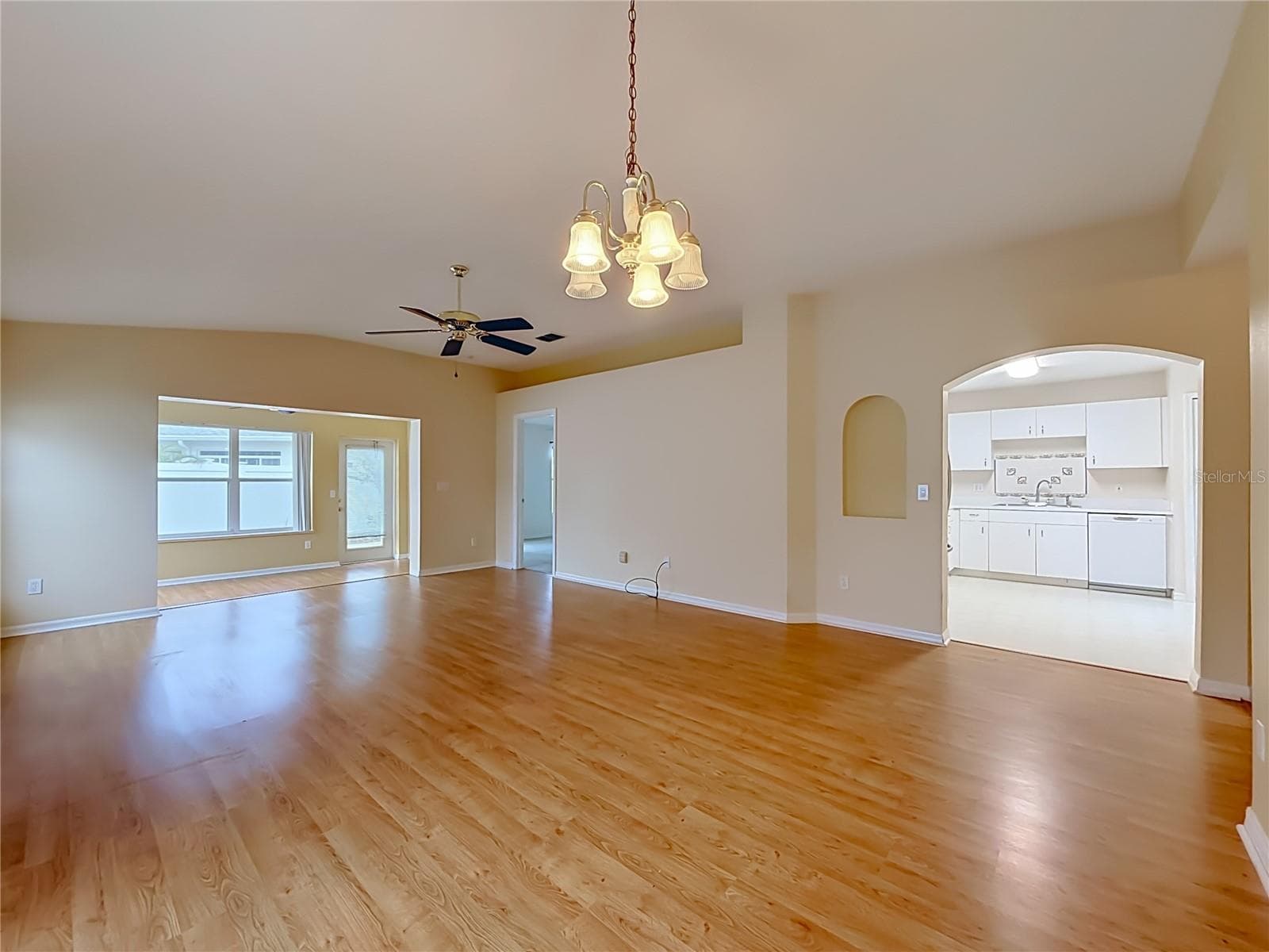 Dining area out to Family room with Kitchen to right - 2038 BRAXTON ST, CLERMONT