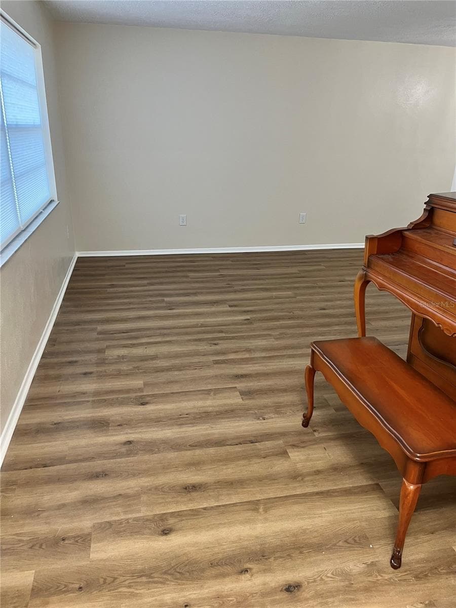 New Easy Care Luxury Vinyl in Neutral tones throughout the home. - 2080 SUN TREE CIR N, CLEARWATER